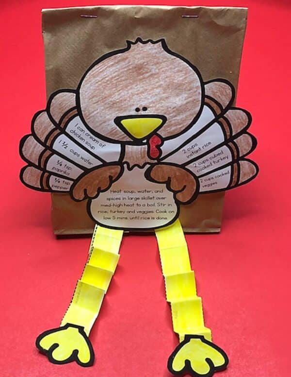 a paper turkey with a paper bag and yellow strips